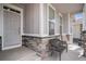 Charming front porch featuring stone accents and comfortable seating at 8852 Farmdale St, Firestone, CO 80504