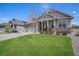 Charming home with a manicured lawn and a welcoming front porch at 8852 Farmdale St, Firestone, CO 80504