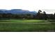 Scenic golf course with rolling green hills and mountain views at 8852 Farmdale St, Firestone, CO 80504