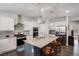 Modern kitchen with stainless steel appliances, granite countertops, and a center island at 8852 Farmdale St, Firestone, CO 80504