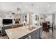 Beautiful, spacious kitchen featuring an island with a granite countertop, stainless steel appliances and an open floorplan at 8852 Farmdale St, Firestone, CO 80504