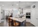 Open kitchen with stainless steel appliances, granite countertops, and island seating at 8852 Farmdale St, Firestone, CO 80504