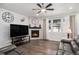 Cozy living room with fireplace, hardwood floors and ample natural light at 8852 Farmdale St, Firestone, CO 80504