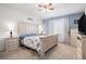 A relaxing bedroom with light blue walls, a white bed frame and matching dressers at 8852 Farmdale St, Firestone, CO 80504