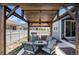 Backyard with a pergola-covered outdoor kitchen, perfect for enjoying summer evenings at 8852 Farmdale St, Firestone, CO 80504