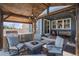 Charming outdoor kitchen with grill, fire pit, and comfortable seating for gatherings at 8852 Farmdale St, Firestone, CO 80504