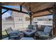 Well-equipped outdoor kitchen under a pergola, offering a great space for outdoor cooking at 8852 Farmdale St, Firestone, CO 80504