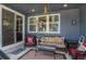 Relaxing outdoor patio with stylish furniture, heater, and a sliding glass door entrance at 8852 Farmdale St, Firestone, CO 80504