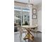 Inviting dining area features a stylish table, elegant chairs, and sliding glass doors leading to the outdoor area at 21823 E 8Th Ave, Aurora, CO 80018