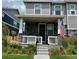 Charming front porch with stone accents, flower beds, and an American flag at 21823 E 8Th Ave, Aurora, CO 80018