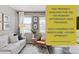 Cozy living room features a comfortable sofa, stylish decor, and ample natural light streaming through the windows at 21823 E 8Th Ave, Aurora, CO 80018