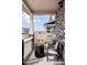 Relaxing front porch features cozy seating, a modern fire pit, and pleasant neighborhood views at 21823 E 8Th Ave, Aurora, CO 80018