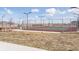 Community tennis courts with fencing and benches, great for sports and recreation at 21823 E 8Th Ave, Aurora, CO 80018