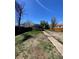 Backyard showing building, fence, and path at 1368 Joliet St, Aurora, CO 80010