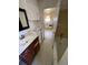 Bathroom with vanity and vintage mirror and fixtures at 1368 Joliet St, Aurora, CO 80010
