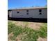 Exterior view of home showing damaged siding at 1368 Joliet St, Aurora, CO 80010