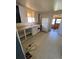 Unadorned kitchen featuring white cabinets, laminate counters, and a refrigerator at 1368 Joliet St, Aurora, CO 80010