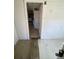 Interior view with light wood flooring leading to another room at 1368 Joliet St, Aurora, CO 80010