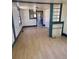Living room with light wood flooring and window with white trim at 1368 Joliet St, Aurora, CO 80010