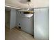 Room with light fixture, light blue walls, and wooden floors at 1368 Joliet St, Aurora, CO 80010