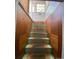 Stairway with paneled walls leading up to a window at 1368 Joliet St, Aurora, CO 80010