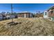 Backyard with a fire pit and a detached garage at 2220 W 73Rd Pl, Denver, CO 80221