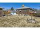 Brick home featuring a sunroom and a spacious backyard at 2220 W 73Rd Pl, Denver, CO 80221