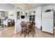Cozy dining area with hardwood floors and classic light fixture at 2220 W 73Rd Pl, Denver, CO 80221