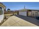 Detached garage with a large driveway at 2220 W 73Rd Pl, Denver, CO 80221