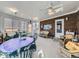 Sunroom with brick walls and a ceiling fan at 2220 W 73Rd Pl, Denver, CO 80221