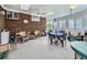 Sunroom with brick accent wall and an abundance of windows at 2220 W 73Rd Pl, Denver, CO 80221