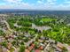 Breathtaking aerial view of the neighborhood, featuring a serene lake and lush greenery at 1070 S Newton St, Denver, CO 80219