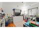 Bedroom decorated with toys and cartoon decor. Features a light carpet and natural light at 1070 S Newton St, Denver, CO 80219