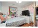 Cozy bedroom featuring a comfortable bed, modern dresser, and personal touches at 1070 S Newton St, Denver, CO 80219