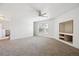 Large bonus room with a ceiling fan and bright light from a large window and built in niche at 1878 S Cole St, Lakewood, CO 80228
