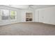 Spacious bonus room featuring neutral carpet, ceiling fan, natural light and built in niche at 1878 S Cole St, Lakewood, CO 80228