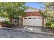 Exterior features a brick front, two-car garage, and well maintained landscaping at 1878 S Cole St, Lakewood, CO 80228