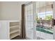 Patio with Sliding glass doors and built in shelves with neighborhood view at 1878 S Cole St, Lakewood, CO 80228