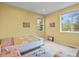 Bright bedroom with large windows, soft carpet and colorful decor at 9536 W Avalon Dr, Littleton, CO 80127