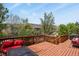 Inviting deck with comfortable seating and a scenic view of the surrounding neighborhood at 9536 W Avalon Dr, Littleton, CO 80127