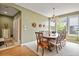 Dining area featuring traditional furniture, a large window, and neutral color palette at 9536 W Avalon Dr, Littleton, CO 80127
