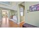 Inviting living room with hardwood floors, neutral walls, a view into dining room, and an open floor plan at 9536 W Avalon Dr, Littleton, CO 80127