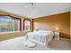 The primary bedroom has large windows with views of the nearby mountains at 9536 W Avalon Dr, Littleton, CO 80127