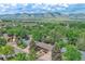 Scenic aerial view of a neighborhood nestled against the backdrop of rolling hills and mountains at 1607 Ulysses St, Golden, CO 80401
