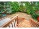 View from wooden deck steps towards backyard at 1607 Ulysses St, Golden, CO 80401