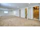 Spacious finished basement with neutral walls and carpeted floors at 1607 Ulysses St, Golden, CO 80401