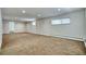 Large basement featuring neutral walls and carpeted floors with windows at 1607 Ulysses St, Golden, CO 80401