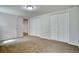Bedroom featuring neutral walls, carpet, and closet space at 1607 Ulysses St, Golden, CO 80401