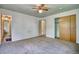 Neutral bedroom with closet, ceiling fan, and access to another bedroom at 1607 Ulysses St, Golden, CO 80401