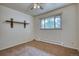 Simple bedroom with wood shelf, neutral carpet, and neutral paint at 1607 Ulysses St, Golden, CO 80401